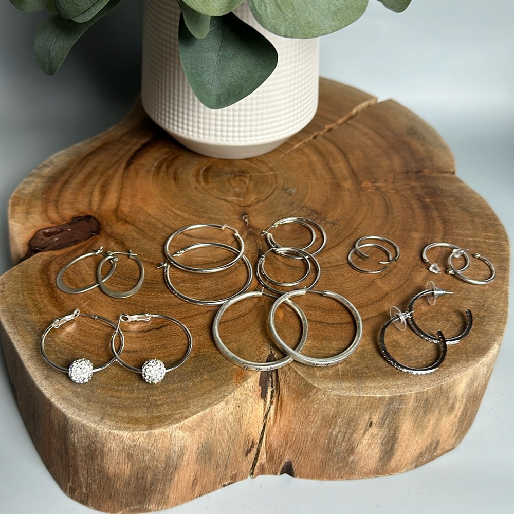 8 pairs of silver hoop earrings